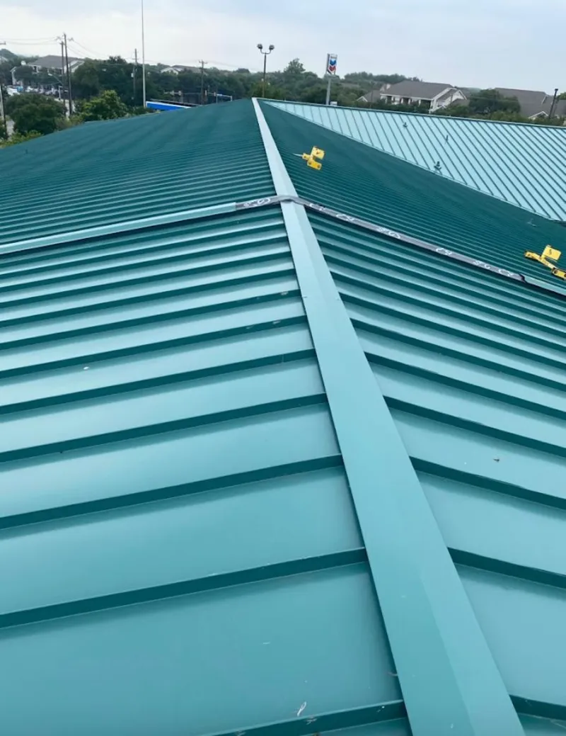 Green commercial metal roof ridge and valley for Metal Roof Repair in St. Augustine Shores