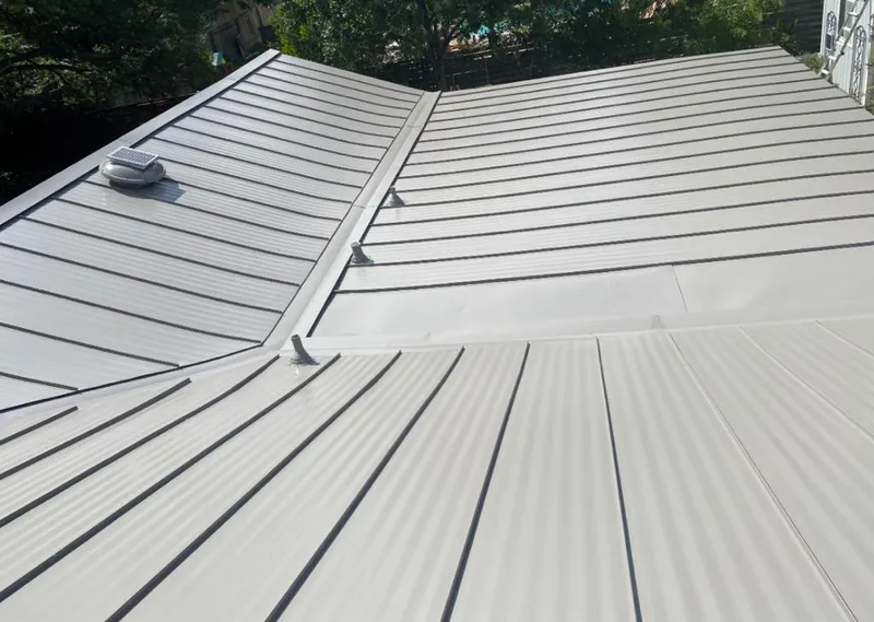 Solar attic fan installed on a metal roof for Roof Ventilation in St. Augustine Shores